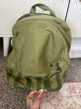 lululemon athletica olive green backpack with branded base print